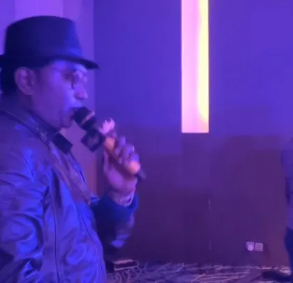 On the mic at the ABB corporate event, getting the crowd hyped up. As an MC, I love interacting with the audience and making them part of the show.