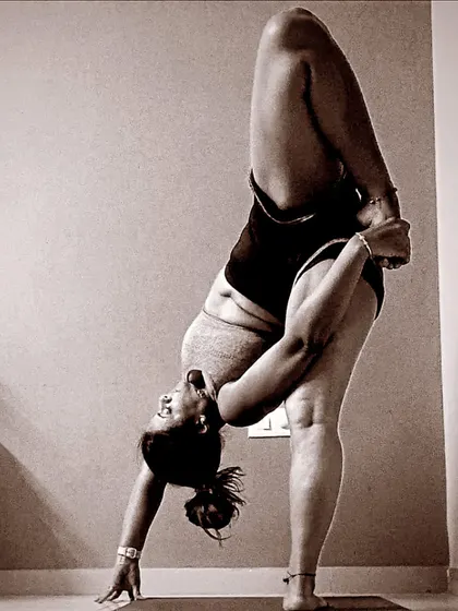 This is a standing split variation with a bind, a pose that intensely stretches the hamstrings and challenges your balance. It requires both flexibility and a strong, stable foundation.