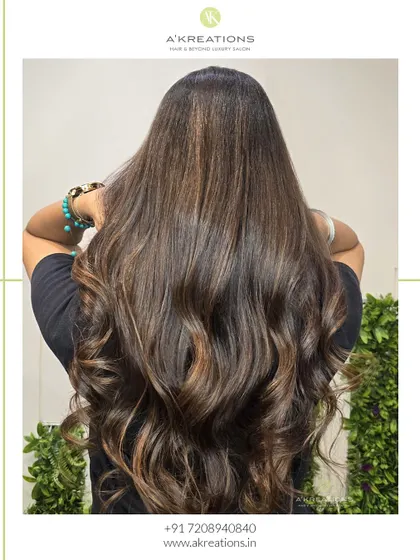 Golden hour meets caramel tones in this stunning look. We created these highlights to give the hair a warm, sun-kissed glow.