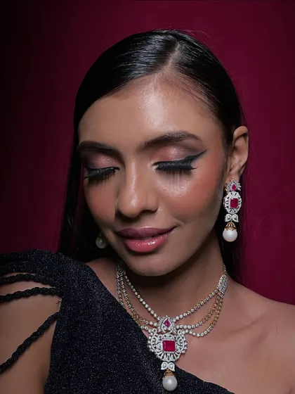 A sophisticated glam look suitable for a red carpet or a luxury jewelry campaign. The focus is on a sharp winged liner and soft, blended eyeshadow to create an elegant, eye-catching effect.