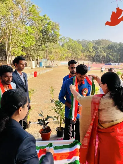 An athlete receives the tricolor sash, a symbol of honor and national pride, during the Republic Day event.