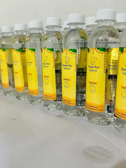 Our custom-branded water bottles, ready for an event. This small detail reflects our professional approach and commitment to providing a complete service.
