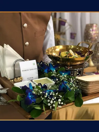 Our Paneer Banjara appetizer is served on a mini grill set upon a tray adorned with fresh flowers. This presentation not only looks beautiful but also keeps the paneer warm for guests.