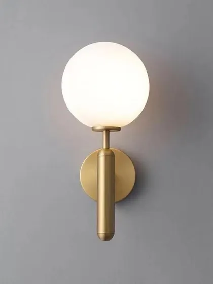 This product shot showcases the warm, even glow produced by the frosted globe sconce. The light is soft and flattering, ideal for creating ambient lighting in living rooms or bedrooms.
