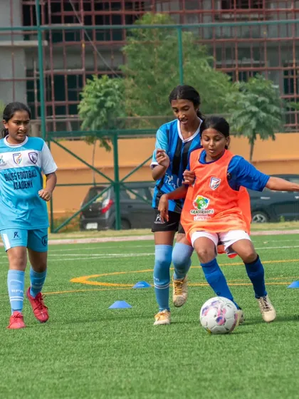 Teamwork in action as our youth players work together to advance the ball up the field.