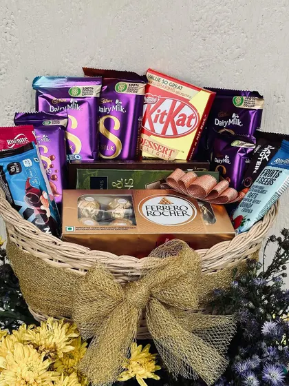 A classic chocolate basket, perfect for any celebration like an anniversary or birthday. This one is overflowing with a variety of Cadbury Dairy Milk, KitKat, and Ferrero Rocher chocolates.