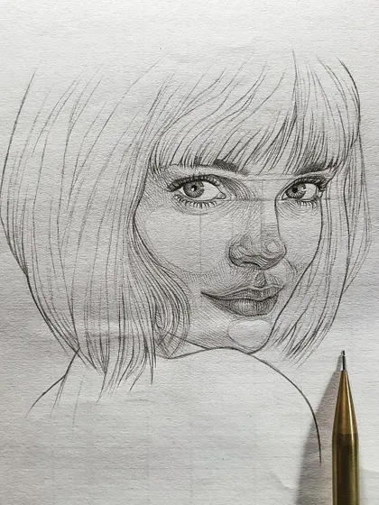 A close-up of the girl's portrait, showing the pencil used for the sketch. It's a simple tool, but capable of creating so much beauty.