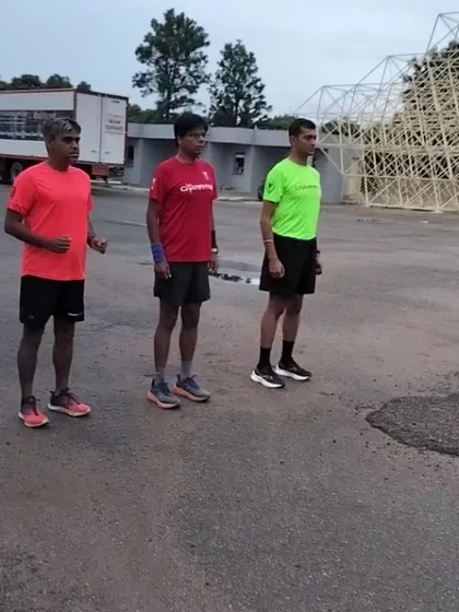 Runners listening intently to instructions before a drill. We are obsessed with technique because doing it right is the only way to get faster.