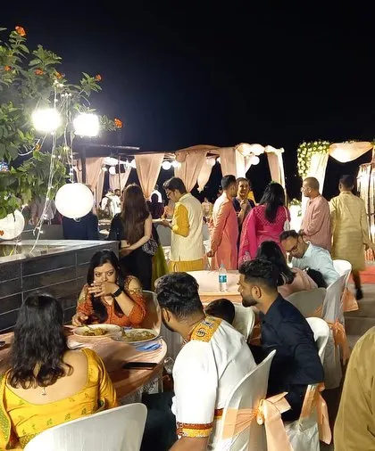 Guests enjoying an outdoor dinner party at a private residence. Our team handles all aspects of catering for house parties, allowing you to be a guest at your own event.