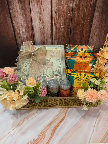 A closer look at the contents of our Rakhi snack hamper. You can see the beautifully illustrated boxes of sweets and snacks, ready to be gifted.