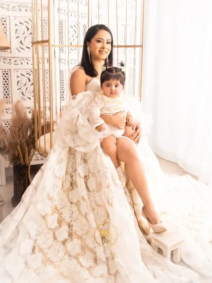A glamorous mother and daughter portrait. The mother wears a stunning lace gown from my client wardrobe, creating an elegant and high-fashion look.