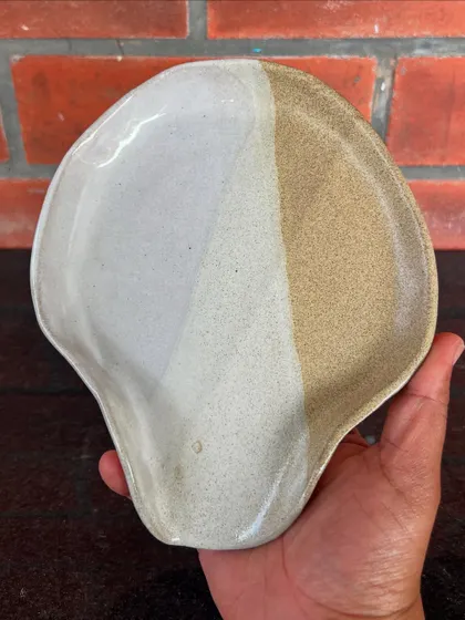 This shell-shaped spoon rest with a two-tone glaze was created by a student in my 15-day combined hand-building and wheel course.