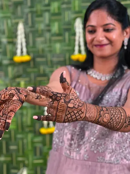 A more dynamic pose, showing the client displaying both of her hands with the full design.