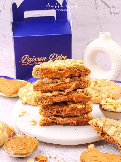 A stack of Biscoff-filled blondies, looking gooey and delicious.