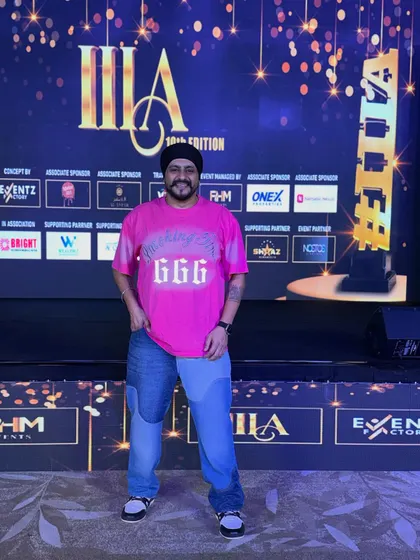 A solo shot on the stage of the IIIA Awards. The professional stage, backdrop, and lighting are all part of the production package I offer for corporate events.
