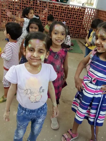 Happy faces covered in organic colors during our safe and fun Holi celebration.