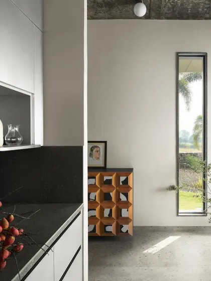 A duplicate of image 130, showing the minimalist kitchen and living area at Pavilion House.