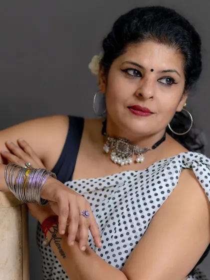 A pensive, classic pose in the polka dot saree. This look channels the timeless elegance of old Bollywood.