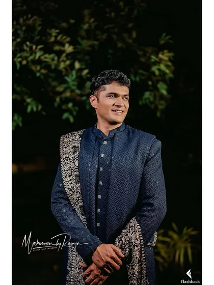 A handsome portrait of the groom, Anil, looking sharp for his reception.