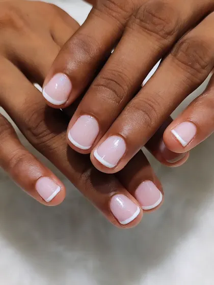 Proof that the French manicure is perfect for any nail length. Here is a clean and classic French look on short, natural nails for a polished and timeless style.