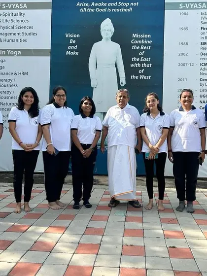 A group photo reflecting our connection to the wider yoga community and its respected institutions. This foundation ensures the practices I teach are authentic and effective.