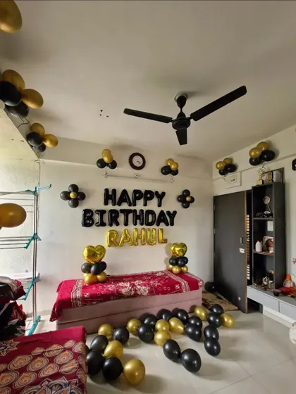 A wide shot of the living room decorated for a birthday surprise.