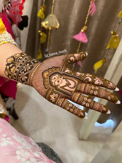 A close-up of a single-hand design with a portrait of a woman. The surrounding floral patterns are delicate and beautiful.