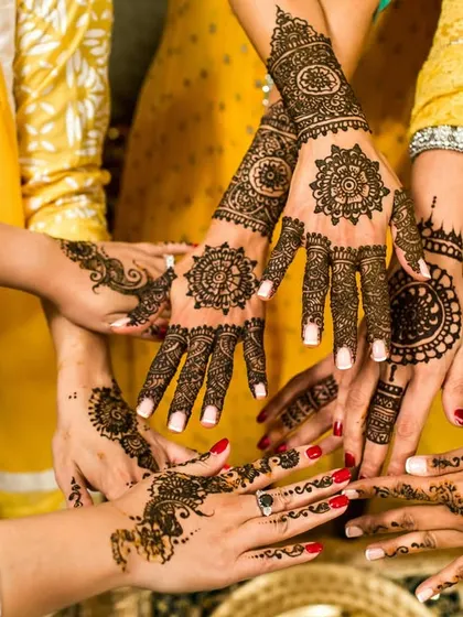 The beauty of Mehndi is in the details. We take artistic shots that focus on the intricate henna designs, celebrating this important tradition with close-up photography that highlights the artistry and the gathering of friends.