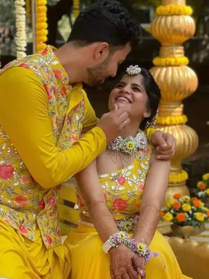 A sweet moment between the happy couple, Amruta and Prasad, during their Haldi. We created a full floral set for Amruta, including a choker, matha patti, and haath phool.