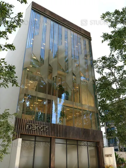 The completed commercial building in Tagore Garden, built on a 200 sq. yard plot. This photo shows the unique frosted glass facade with an abstract pattern, which provides privacy while creating a striking visual effect.