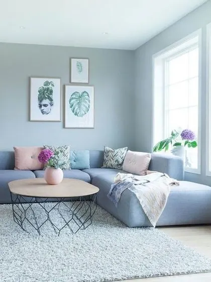 Creating a light and airy living room starts with the right wall colour. This soft, cool grey provides a versatile backdrop that enhances natural light and complements modern furniture.