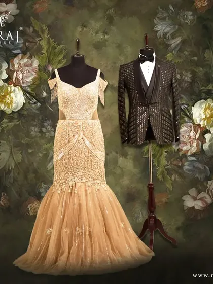 A perfect pair for a glamorous evening. The groom's sophisticated black tuxedo with modern embellishments stands alongside a stunning gilded gold mermaid gown, creating a look of pure luxury.