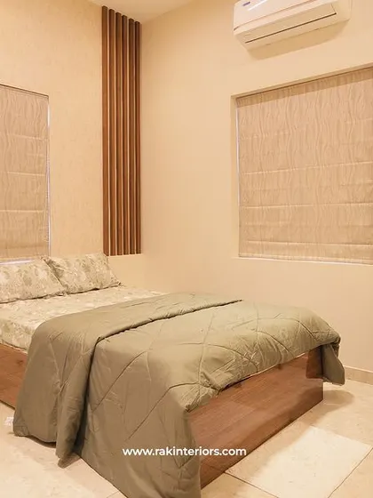 Another view of the simple and functional bedroom with a study desk.