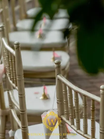 Cones of flower petals placed on each guest's chair. This small detail invites guests to be a part of the celebration by showering the couple with blessings.