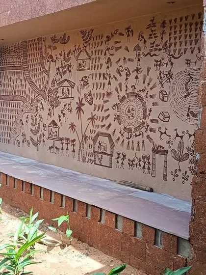 A detailed view of a wall at the Bagchi Karunashraya hospice, featuring intricate traditional artwork. This integration of art adds a layer of cultural richness and humanity to the space.