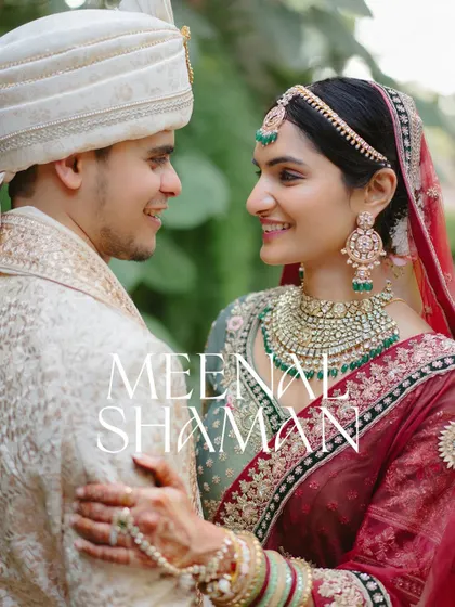 A classic, elegant portrait of the couple. The bride's stunning green lehenga and the groom's ivory sherwani complement each other perfectly.