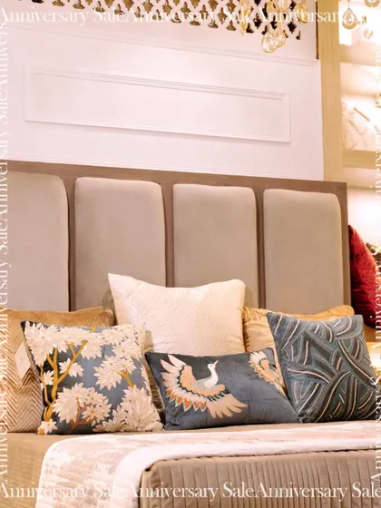 My 10th-anniversary sale features my nature-inspired home furnishings. This bed is layered with a variety of embroidered cushions, showcasing designs like cranes and botanicals that bring the outdoors in.