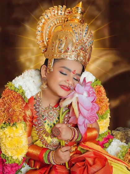 A blissful moment captured during our Navarathri special concept shoot. The child, dressed as a goddess, looks serene and divine, creating a truly magical photograph.