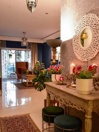 A classic look for my foyer. I love styling this space to be a warm welcome for anyone who walks in, using a mix of textures like this carved console table, an ornate mirror, and fresh flowers.