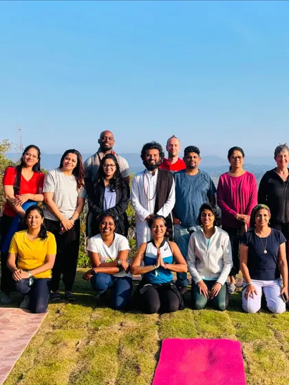 A happy group photo after a morning yoga session at Shoonya Farm Retreat. The fresh air and beautiful scenery amplified the benefits of our practice, leaving everyone energized and smiling.