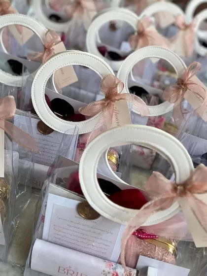 A collection of our clear bridesmaid gift bags, all packed and ready for the bride's tribe.