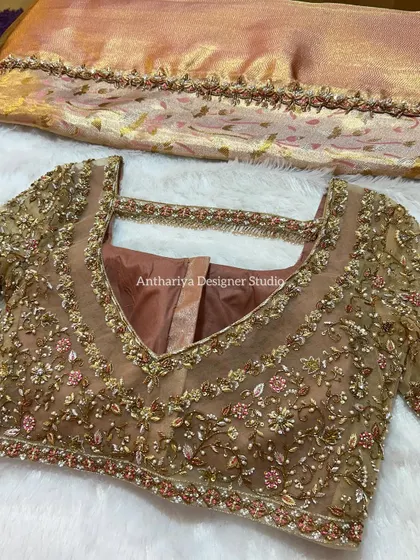 A full view of the front of the blouse, showing the delicate embroidery work.