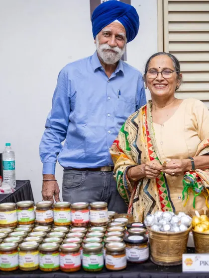This is a family business, built with love. Here I am with my husband, my biggest supporter, at one of our market stalls, ready to serve you.