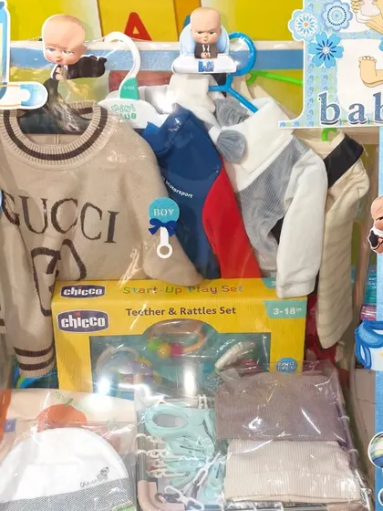 A premium baby hamper including a Gucci sweater and a Chicco teether set. I can pack luxury items as well.