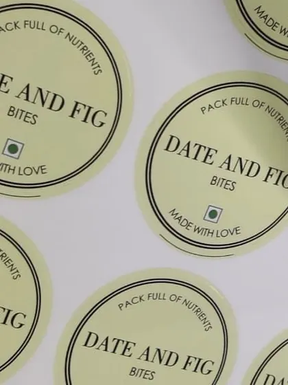 Custom-designed stickers for 'Date and Fig Bites', featuring a clean and simple design that communicates the product's natural ingredients.