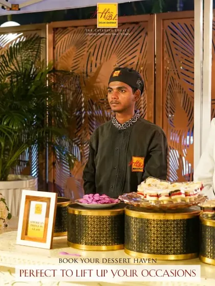 Book your dessert haven to lift up your occasions. A beautiful three-tiered wedding cake is the centerpiece of this elegant dessert station.