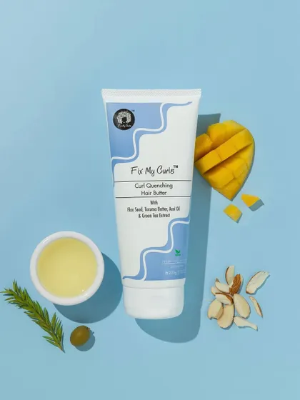 This vibrant, color-coordinated flatlay uses a bright blue background to make the natural ingredients pop. The composition with mango, almonds, and olive oil is fresh, tropical, and appealing.