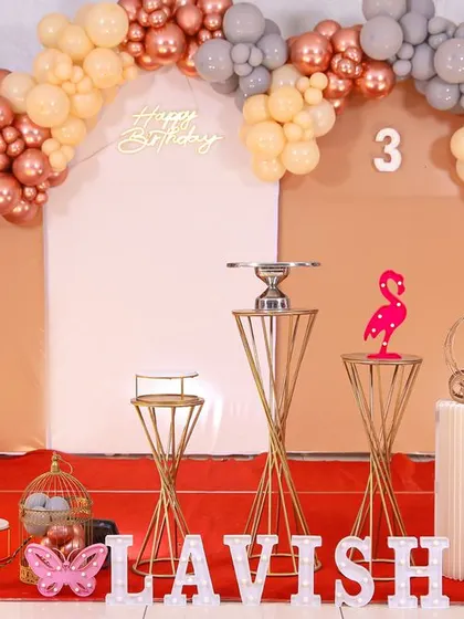 A charming 'Baby Boss' themed birthday party, with a sophisticated black and white color scheme, custom props, and a stylish backdrop, perfect for a little executive.