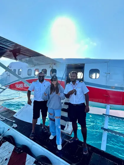 Posing with the pilots of the seaplane, ready for an island adventure and a new gig.