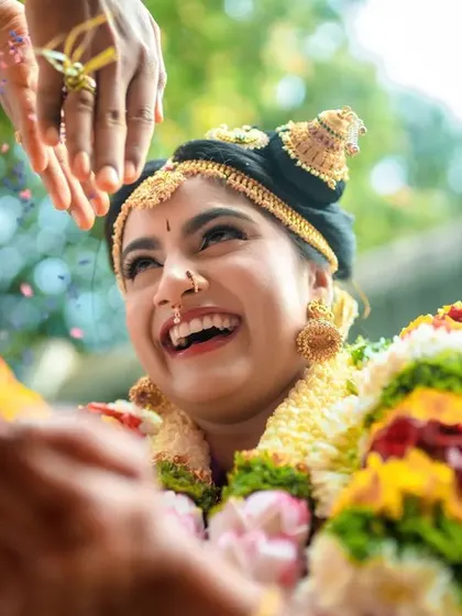 A duplicate of 139, a close up of a bride's radiant smile during a ritual.